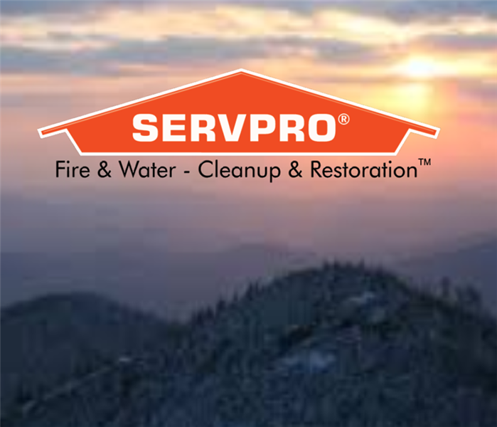 East Tennessee mountains at sunset with SERVPRO logo.