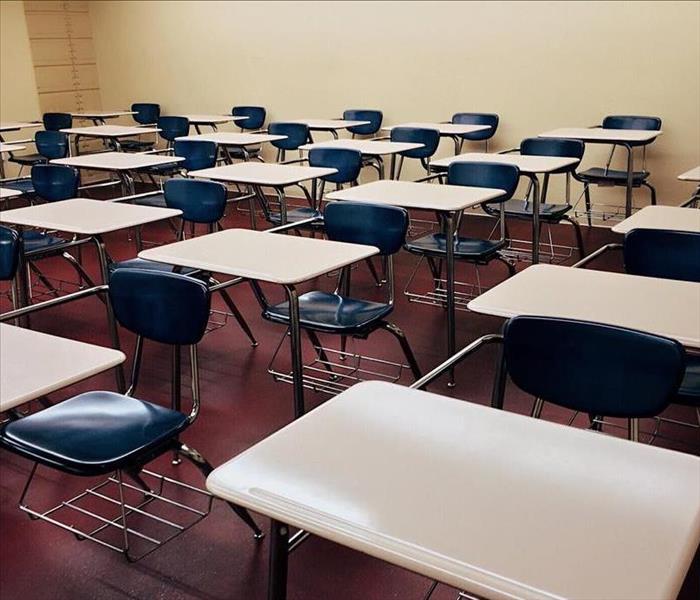 School desks sitting in rows in classroom